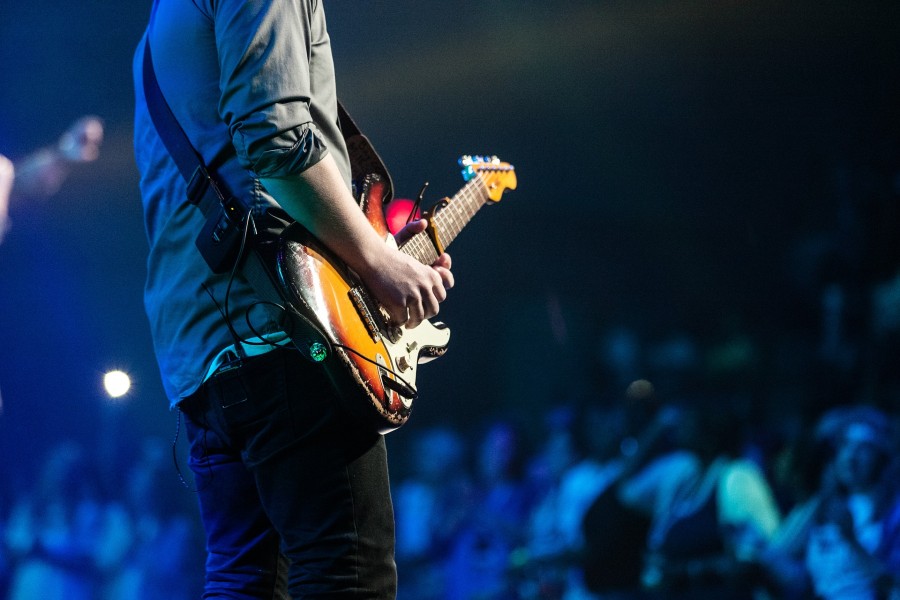 musician playing guitar at his best