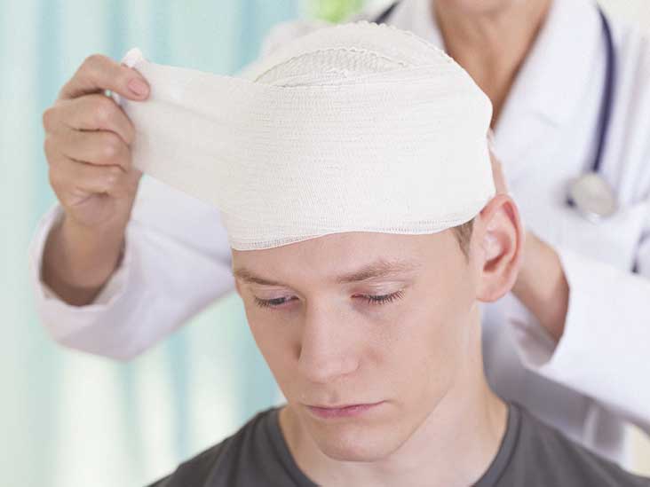 doctor treating a patient with a concussion