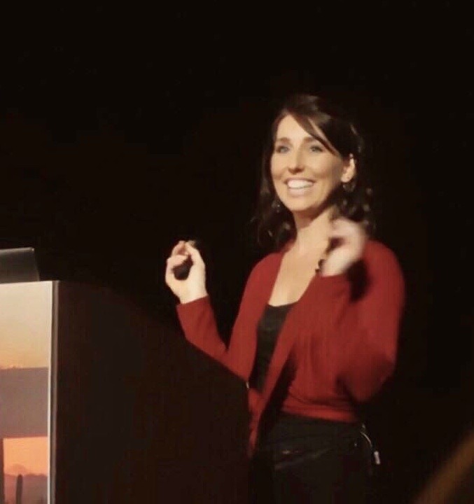 Dr Ashlie Bell speaking at a conference