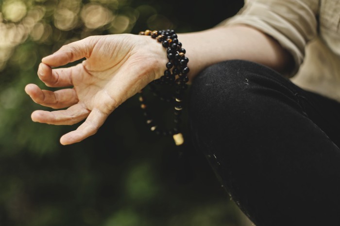 womans hand while meditating